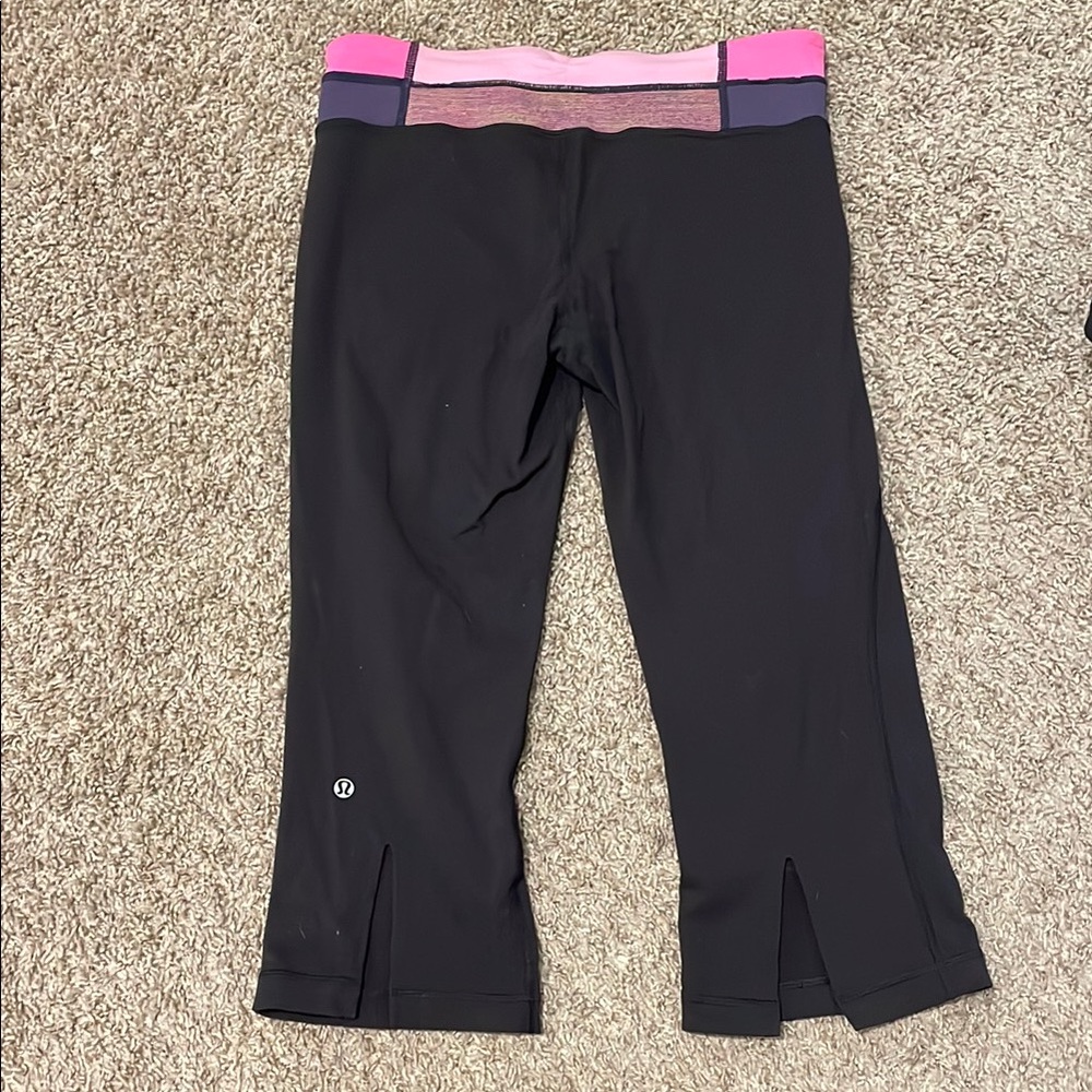 Lululemon black 3/4 length yoga pants with pink waistband